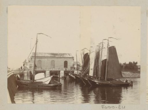 Moored sailing ships at the Oranjesluizen, Amsterdam