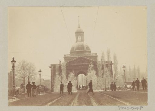Snow-covered Muiderpoort in Amsterdam, viewed from the east