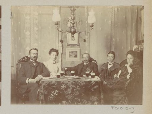 Company drinking around a table