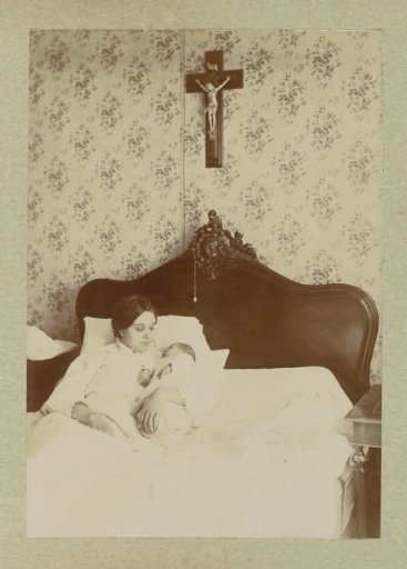Mother with a Baby in a Cradle