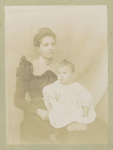 Portrait of a woman with a baby on her lap