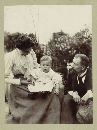 Man and a woman with a baby on her lap