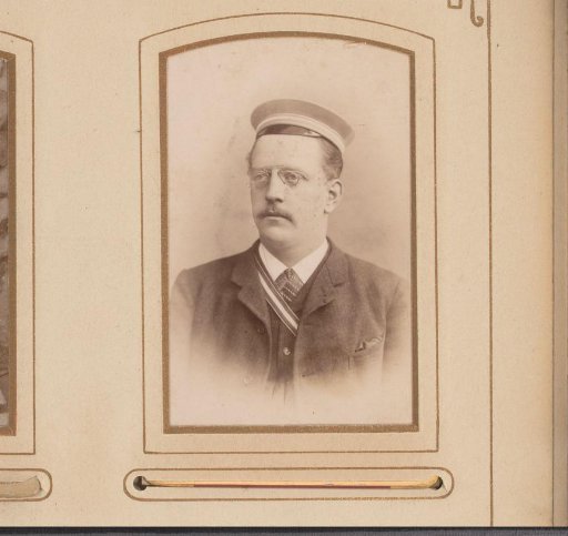 Portrait of a man with a mustache and cap