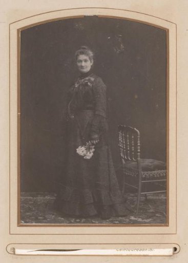 Portrait of a standing woman with flowers