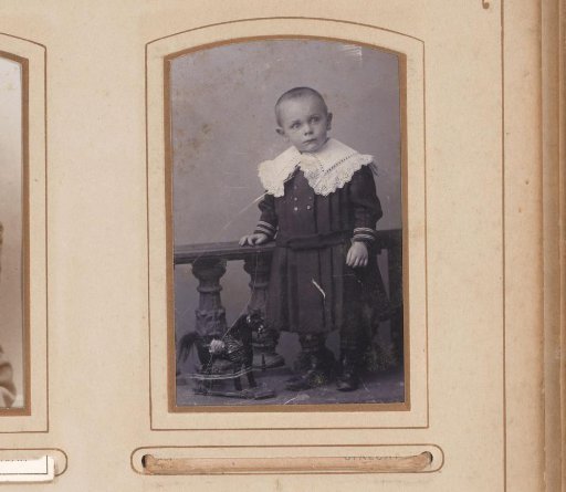 Portrait of a child standing by a balustrade