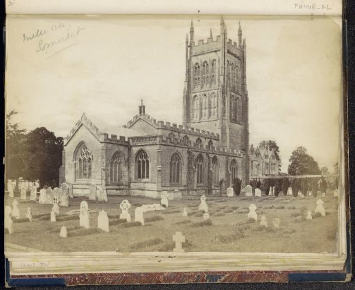 Exterior of the church of St. Andrew with a churchyard in front in Mells