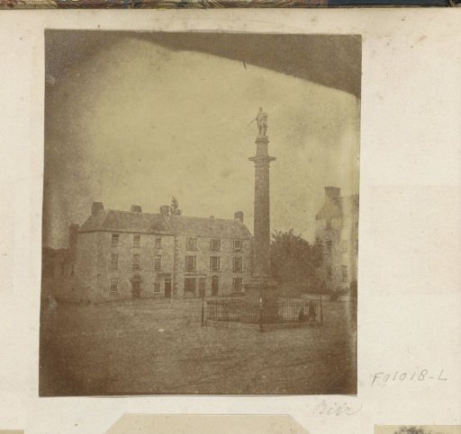 View of a square with a triumphal column in Birr