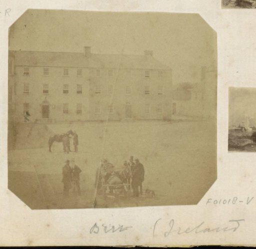 People with horse and cart on a square in Birr