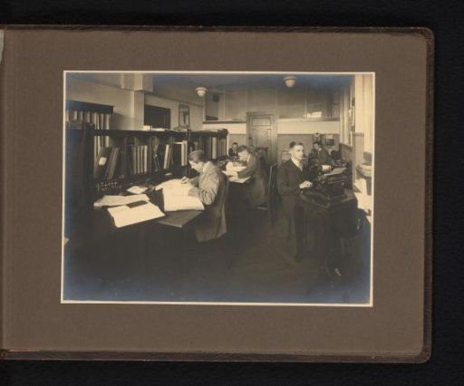 Five men in an administrative office