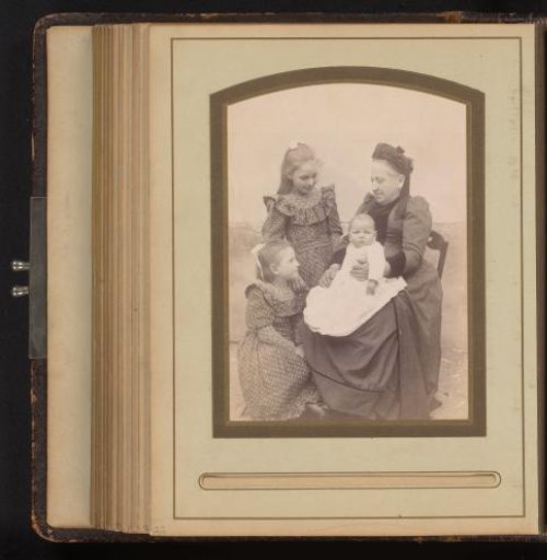 Group Portrait of a Woman with a Baby on Her Lap and Two Young Girls