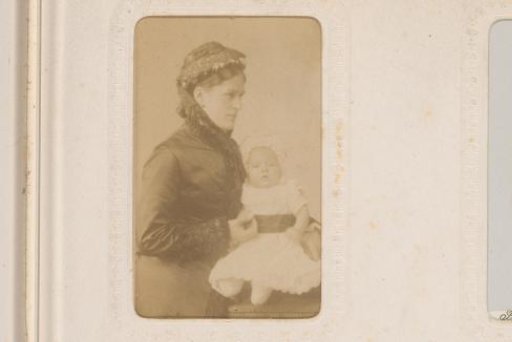 Portrait of a woman with a baby on her lap