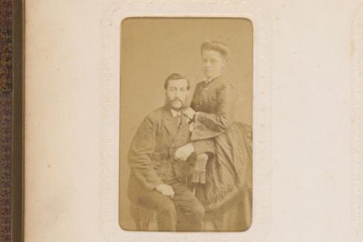 Portrait of a seated man and a standing woman