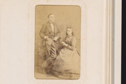 Portrait of a standing man and a seated woman
