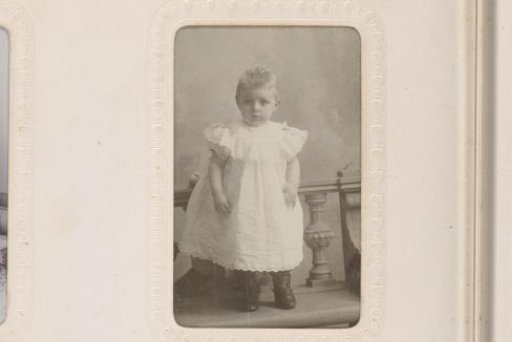 Portrait of a Boy, Standing by a Chair with a Drum