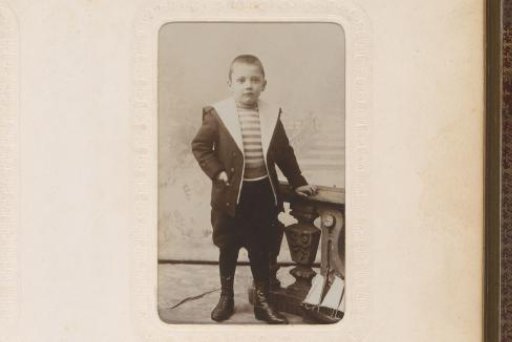 Portrait of a Standing Boy by a Balustrade, with a Toy Sailboat on the Floor
