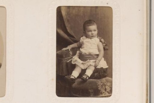 Portrait of a Sitting Toddler and a Standing Girl
