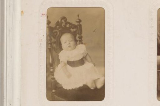 Portrait of a Boy in a Jacket and Cap, Standing on a Chair
