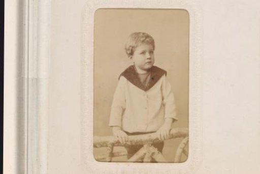 Portrait of a Standing Girl Leaning on the Seat of an Armchair