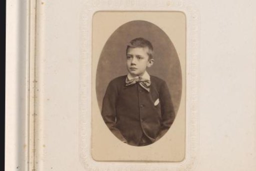 Portrait of a Boy Standing on a Footstool Beside a Chair with a Hat