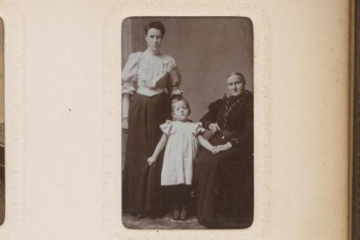 Portrait of a standing woman, a seated woman and a standing girl