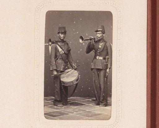 Two Indonesian soldiers with musical instruments