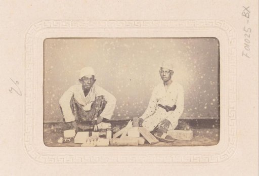 Two Young Indonesian Merchants with Goods