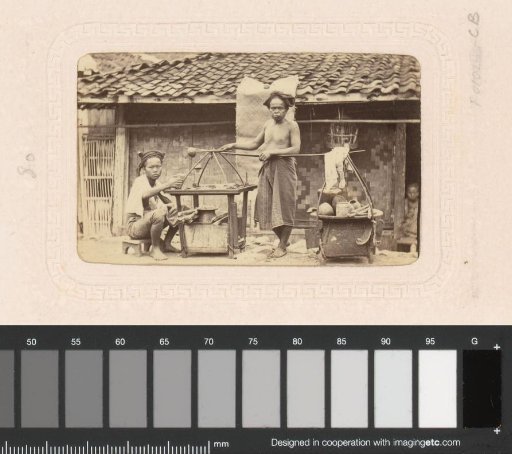 Two Indonesian Men in Front of a House