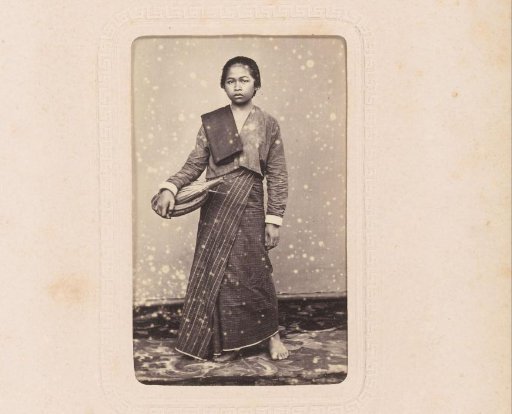 Portrait of a standing Indonesian woman with a basket