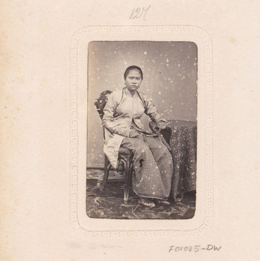 Portrait of a young, seated Indonesian woman
