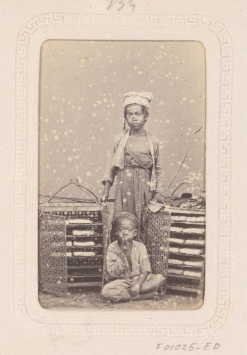 Portrait of two Indonesian children with carrying baskets