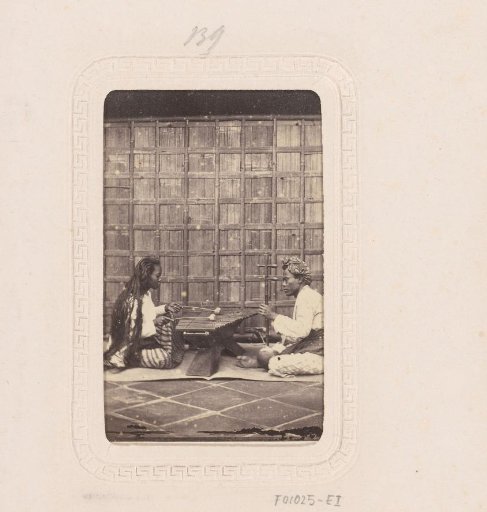 Indonesian woman and man with musical instruments