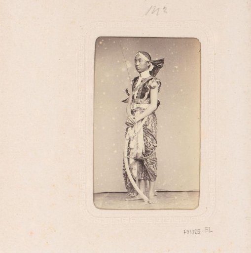 Portrait of an Indonesian man with a sword