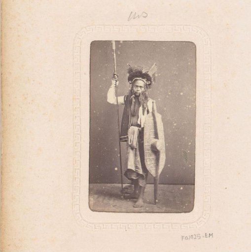 Portrait of a young Indonesian man with spear and shield