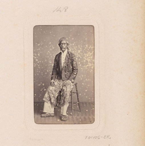 Portrait of an Indonesian man on a stool