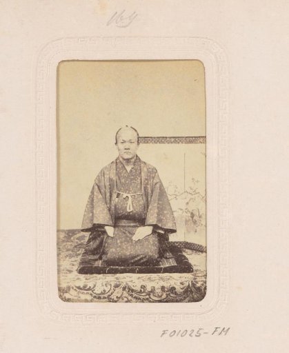 Portrait of a Japanese man seated on his knees