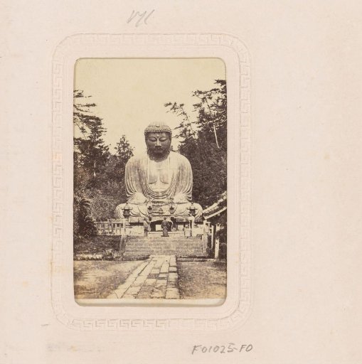 Japanese priests before a Buddha image