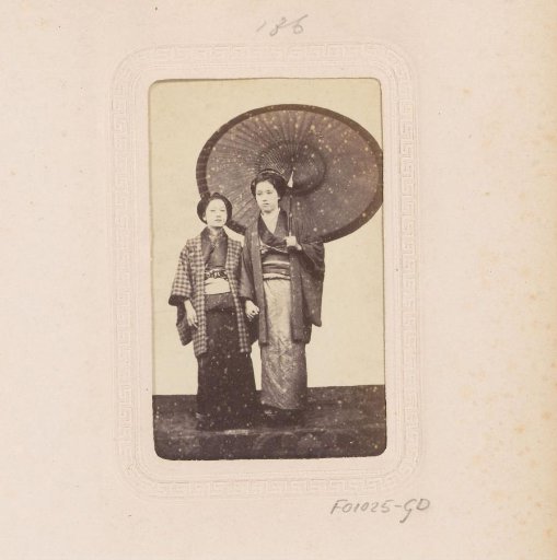 Portrait of two Japanese women with a parasol