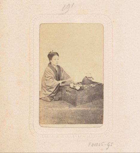 Portrait of a Japanese woman with a book and tea