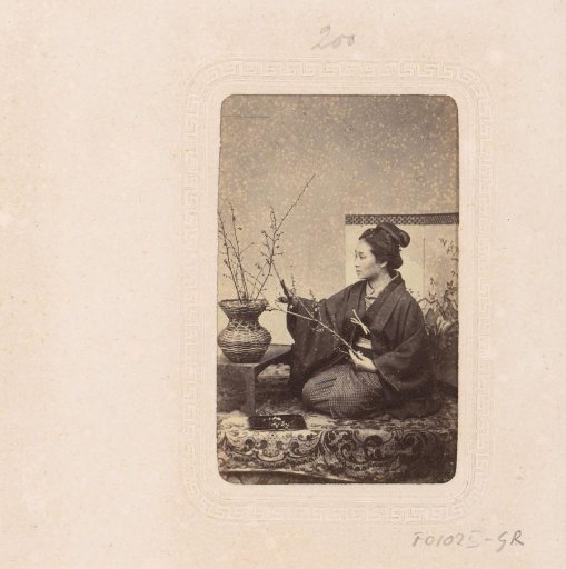 Portrait of a Japanese woman arranging flowers