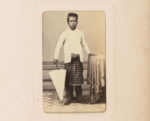 Portrait of a Malay man with an umbrella