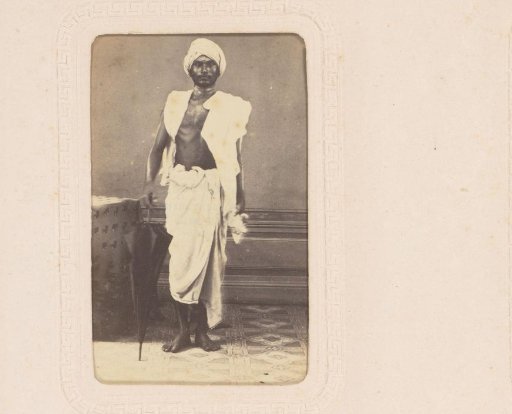 Portrait of an Indian man with an umbrella