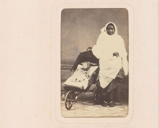Portrait of an Indian governess with a pram and baby in Singapore