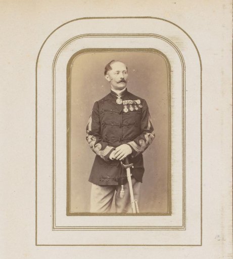 Portrait of a man with a sword in uniform with medals