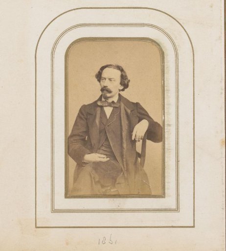 Portrait of a seated man with a mustache