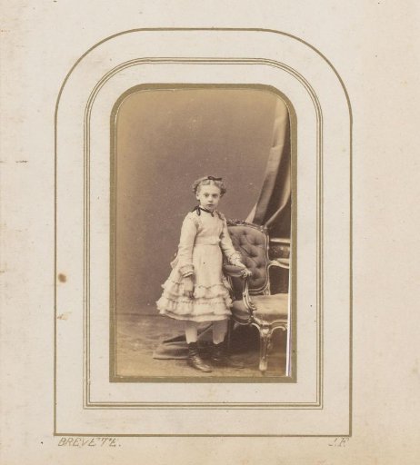 Portrait of a Girl Standing by a Chair