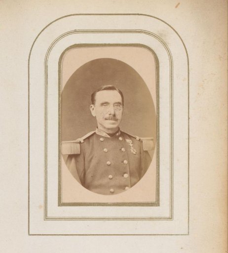 Portrait of a man with a mustache and glasses in uniform