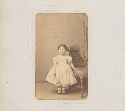 Portrait of a Girl Standing by a Chair