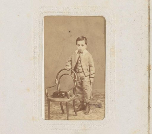 Portrait of a Boy Standing by a Chair