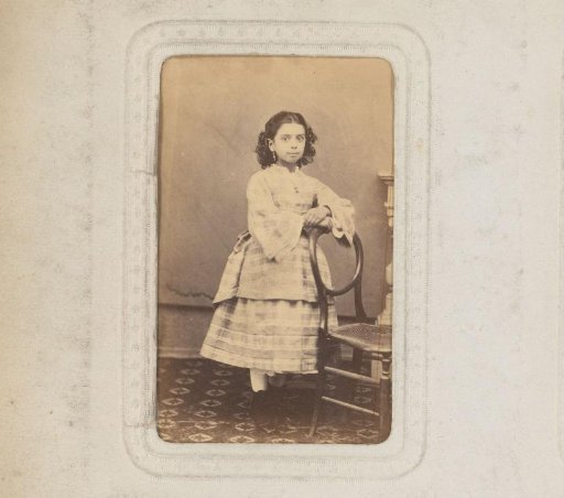 Portrait of a Girl Standing by a Chair