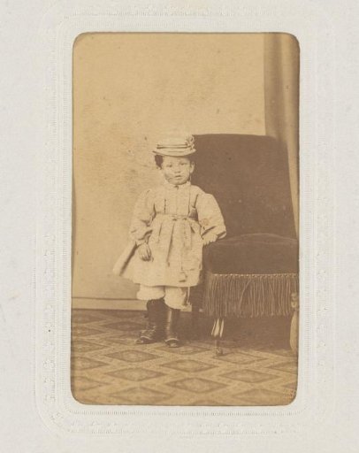 Portrait of a Child with a Hat, Standing by a Chair